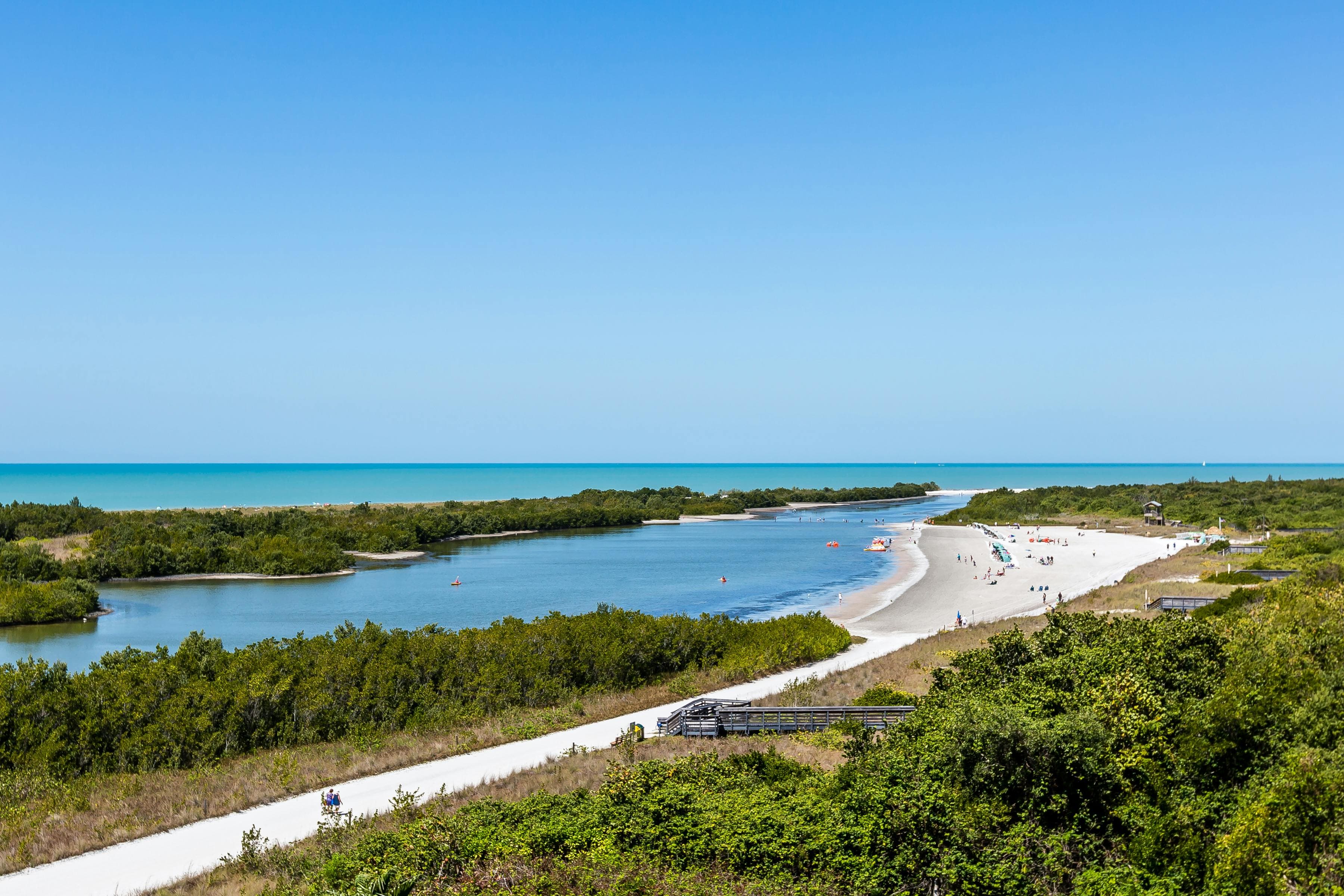 Aerial view of Tigertail Beach in Marco Island, Florida, with shoreline, water, and greenery.